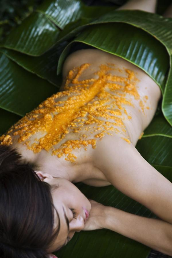 Hard Rock Hotel Goa Calangute Exterior photo A woman with turmeric applied to her back