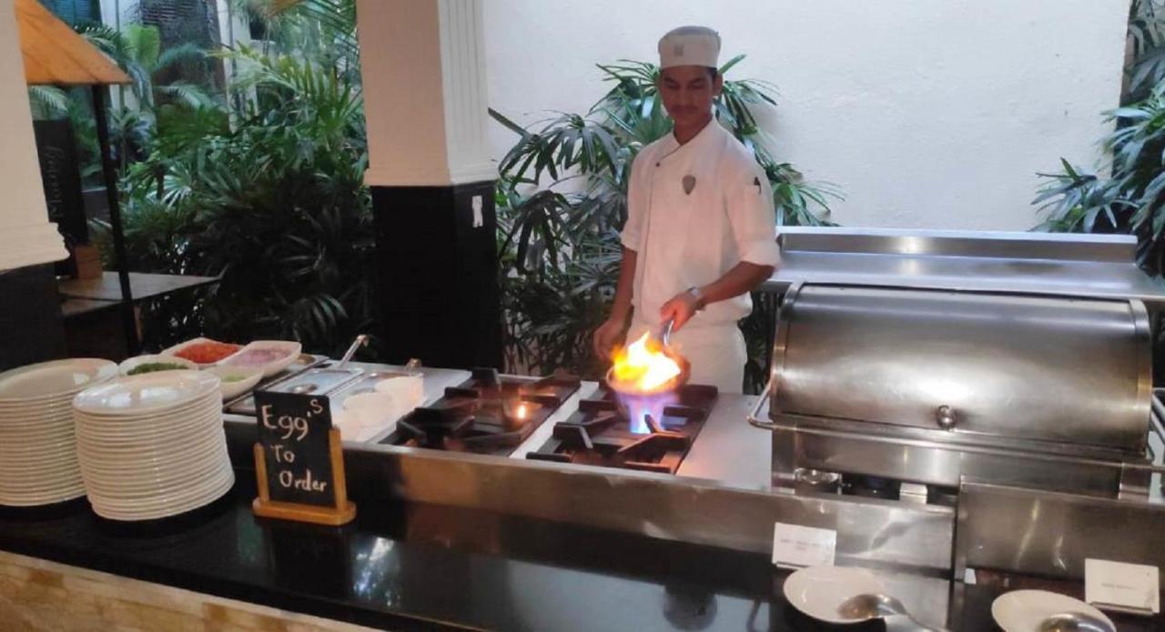 Hard Rock Hotel Goa Calangute Exterior photo A chef cooking with a blowtorch